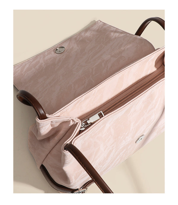 Structured crinkle-finish flap shoulder bag with butterfly metal appliqué and dark brown contrast trim, detail view 15