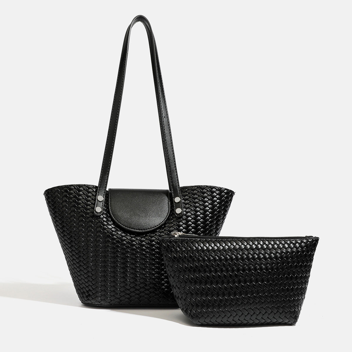 Black woven trapezoid shoulder tote with smooth front flap, silver rivets, twin long straps, and matching inner zip pouch