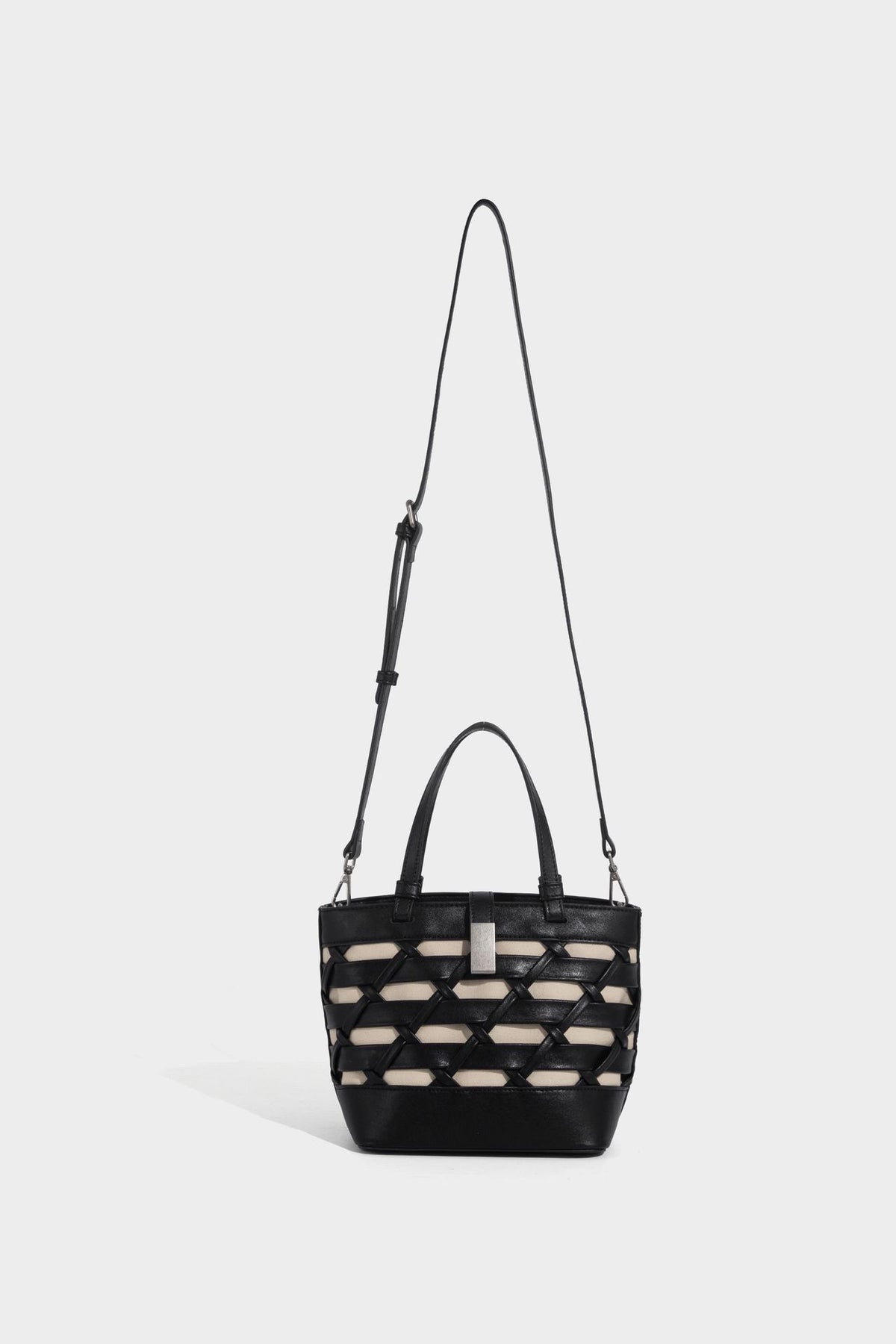 Structured woven lattice tote bag with cream lining, dual top handles, detachable crossbody strap, and silver-tone hardware