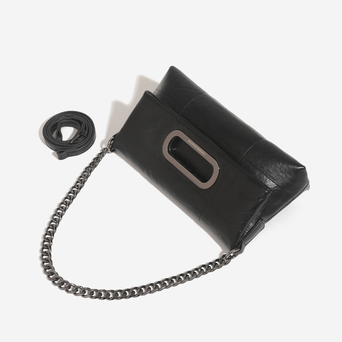 Soft rectangular leather-look convertible shoulder bag with dark curb-chain strap and rounded rectangular metal handle