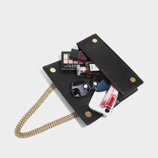 Slim rectangular crossbody bag with gold-tone butterfly metal appliqués and fine antiqued chain strap, detail view 4