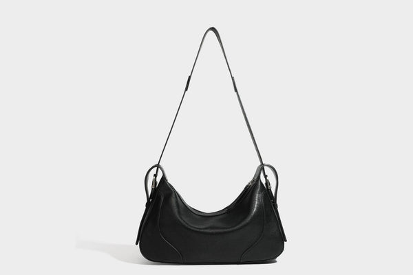 Slouchy crescent hobo shoulder bag in dark brown pebbled leather-look finish with zip top and long shoulder strap, detail