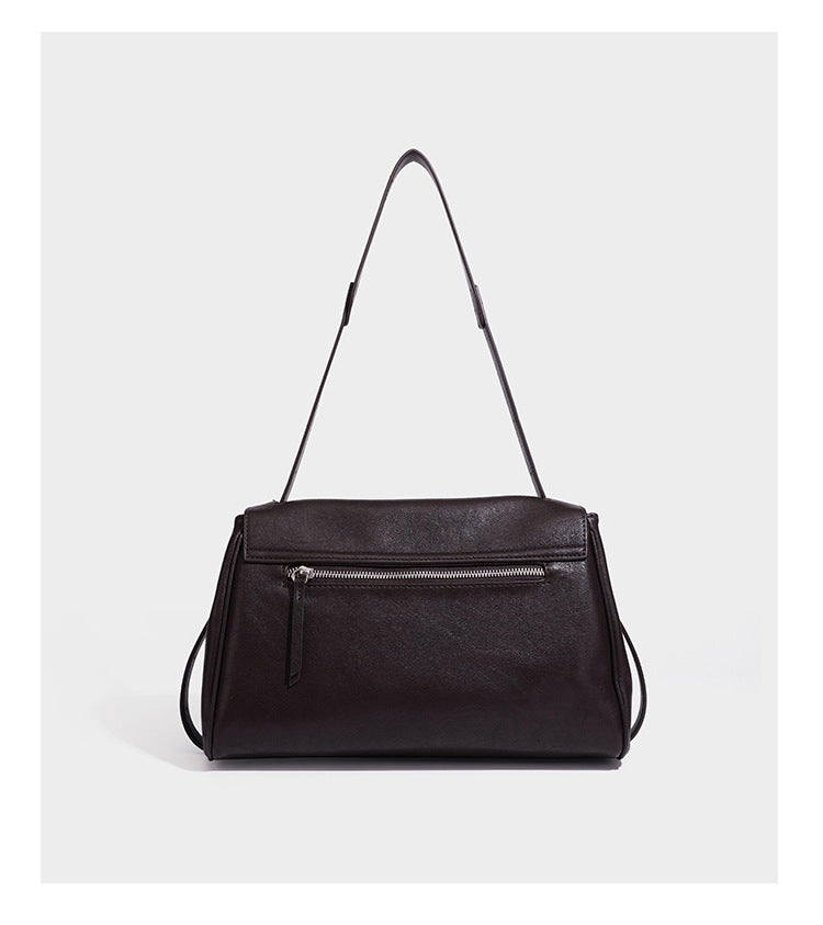 Structured rectangular flap shoulder bag in dark brown leather-look finish with long single strap and layered front panel