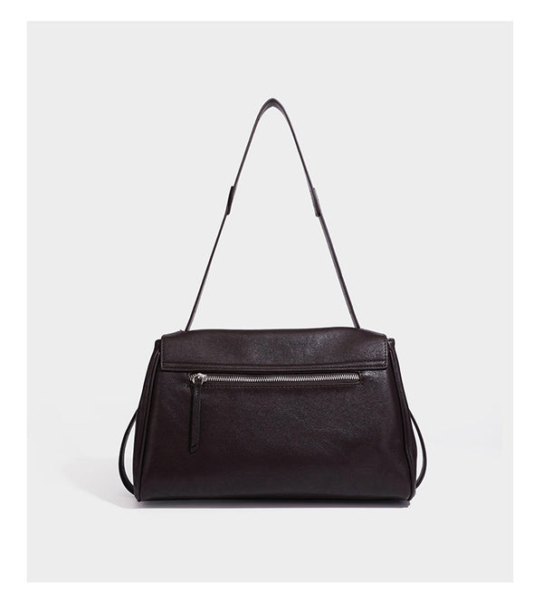 Structured rectangular flap shoulder bag in dark brown leather-look finish with long single strap and layered front panel