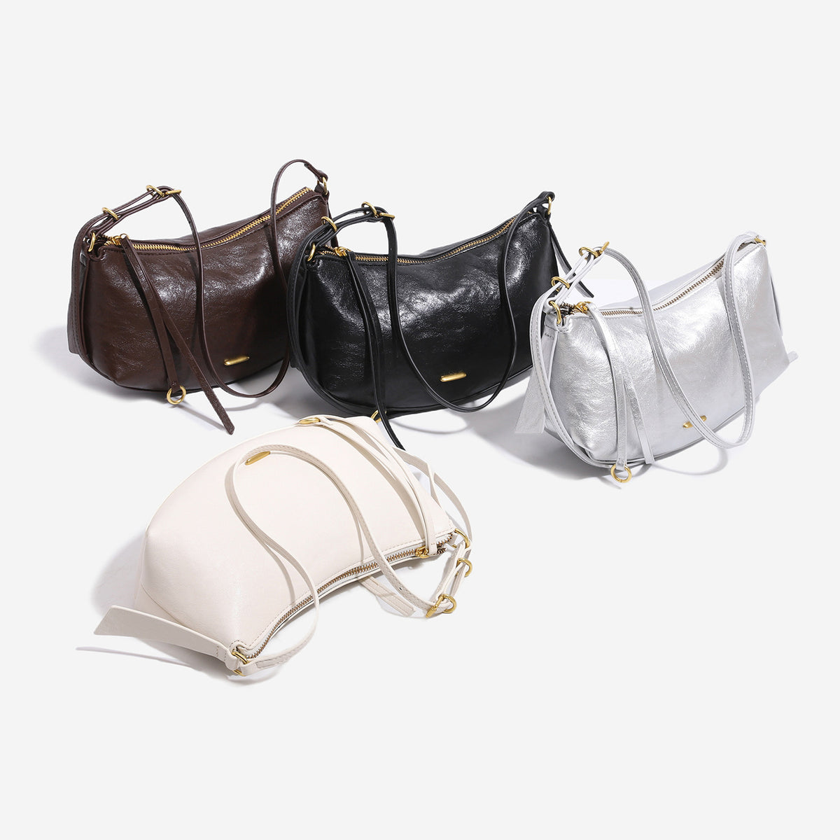 Compact soft rounded zip-top shoulder bag with gold-tone hardware and adjustable crossbody strap, detail view 2