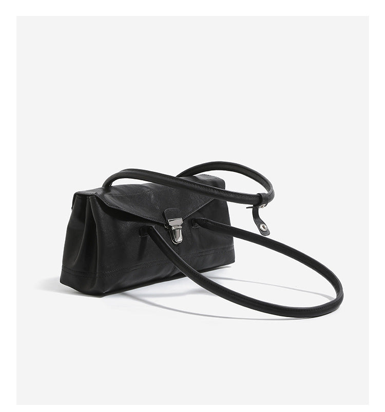 Compact structured rectangular flap shoulder bag with silver-tone turn-lock clasp and long rounded handles, detail view 10
