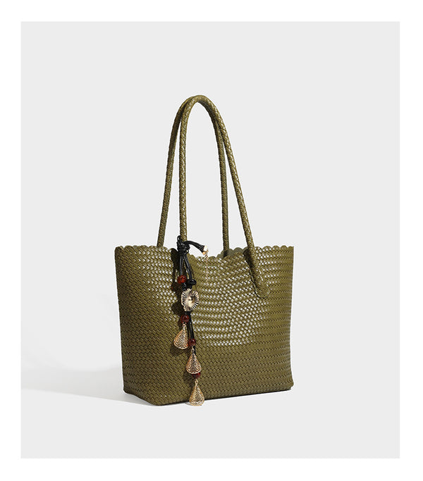 Large open-top woven leather-look tote bag in dark brown with scalloped edge, braided double shoulder straps, and decorative