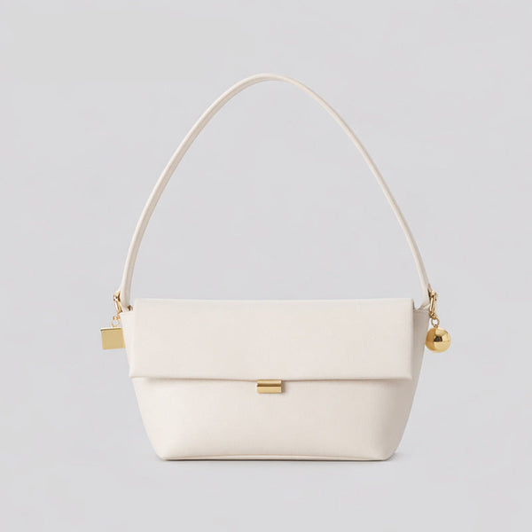 Structured trapezoid flap shoulder bag in red leather-look finish with gold-tone turn-lock clasp, sphere accent, and curved