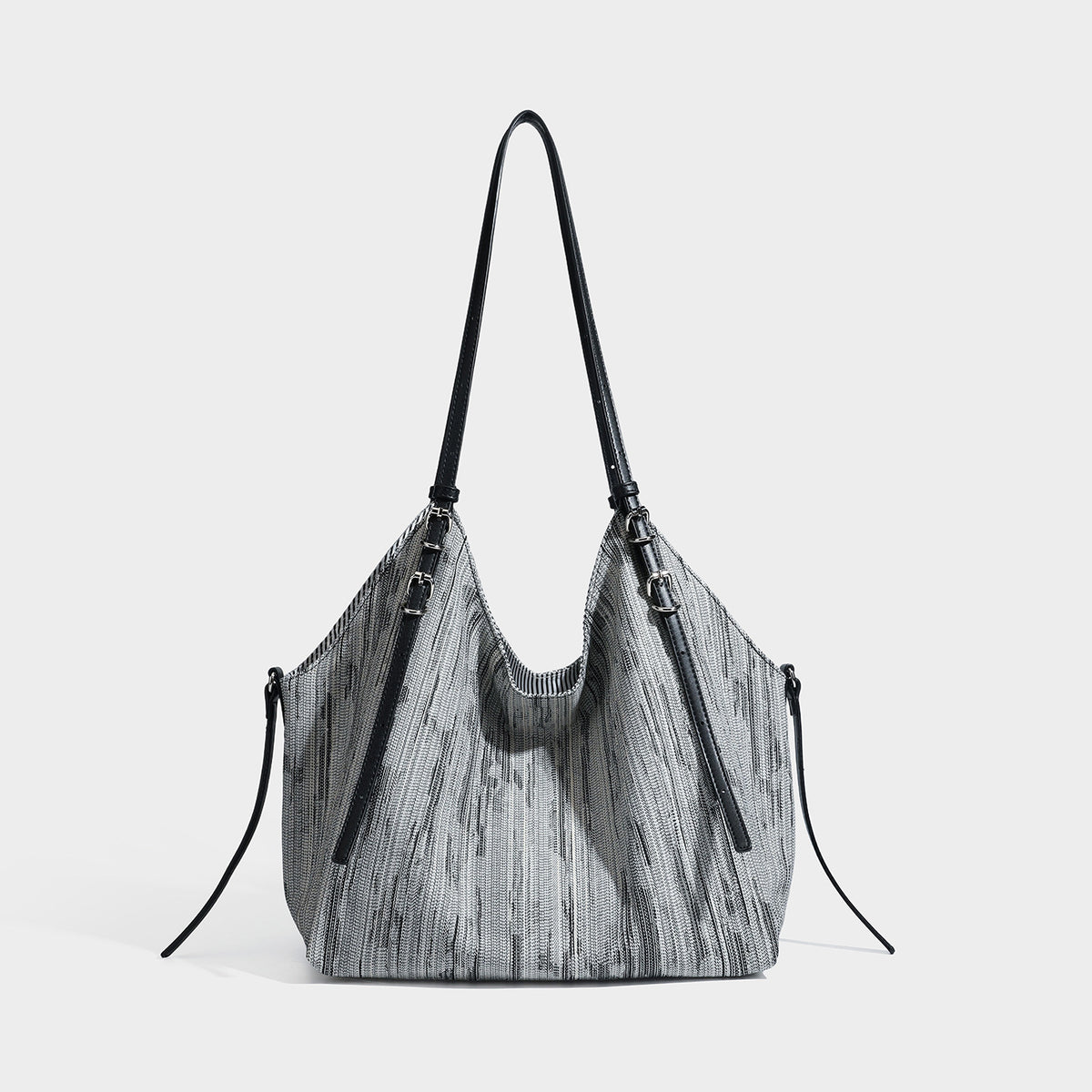 Large slouchy woven-texture shoulder tote bag with slim leather-look straps, side cinch ties, and silver-tone hardware