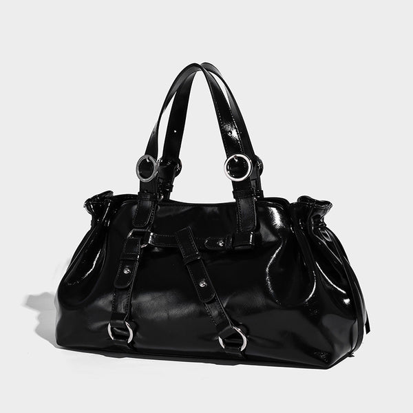 Glossy patent-look slouchy tote bag with ruched drawstring sides, dual top handles, silver ring hardware, and detachable