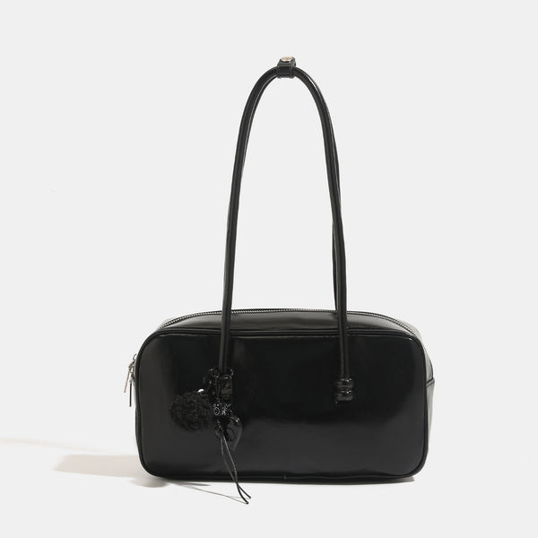 Kastenförmige, rechteckige Bowling-Schultertasche mit glänzender Lederoptik, zwei abgerundeten Tragegriffen, Reißverschluss oben und abnehmbarem