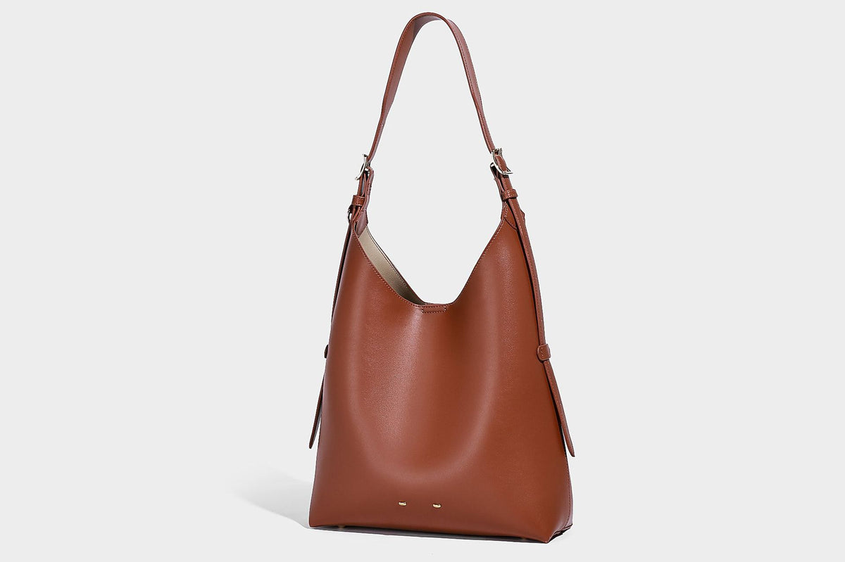 Large open-top hobo shoulder bag in tan leather-look finish with detachable zip pouch and adjustable buckle strap, detail