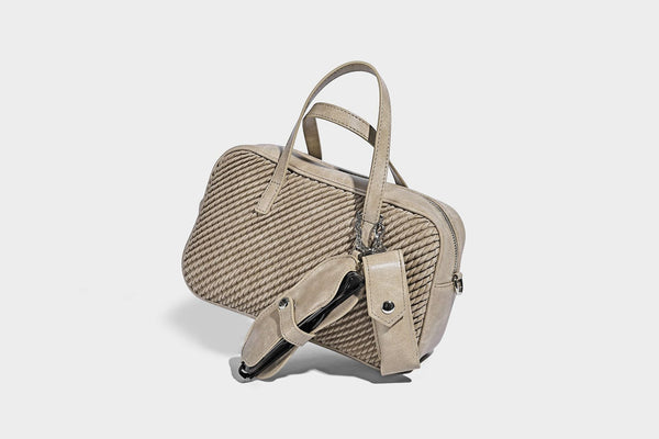 Structured woven-texture front top-handle handbag with zip closure, dual handles, detachable shoulder strap, and matching