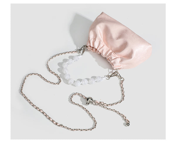 Small ruched drawstring pouch bag with pearl-bead handle and silver-tone chain strap, detail view 13