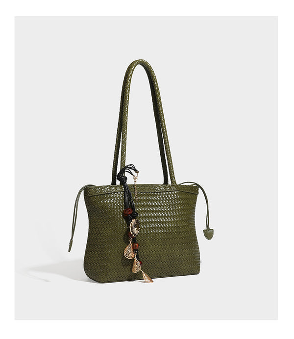 Structured woven leather-look tote bag in dark brown with long shoulder straps, side drawstring ties, and gold filigree