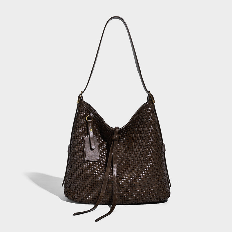 Slouchy woven-texture bucket shoulder bag with tassel tie closure and gold-tone hardware, detail view 6