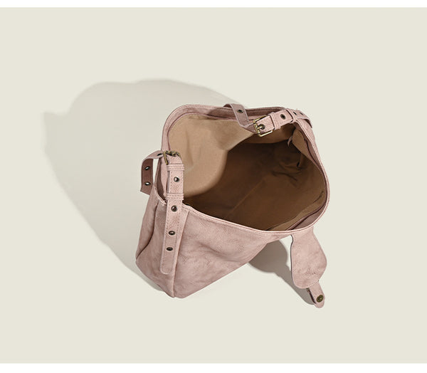 Slouchy distressed leather-look hobo bag with antique brass buckle closure and adjustable shoulder strap, detail view 9