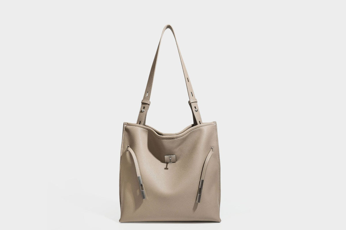 Pebbled leather-look tote bag with front toggle hardware and long shoulder strap, detail view 23