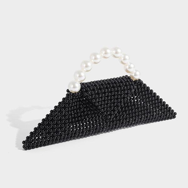 Small structured triangle clutch bag covered in glossy pearl beads with an arched pearl top handle and silver snap closure
