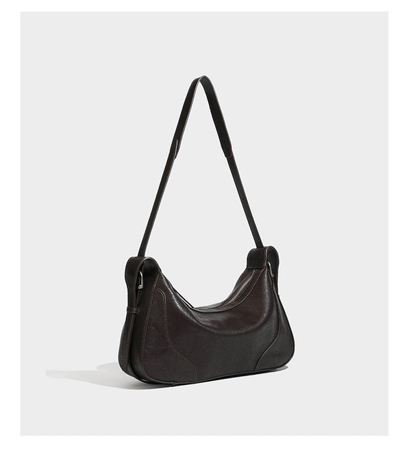 Dark brown curved zip-top hobo shoulder bag with slim adjustable strap and silver-tone hardware, detail view 11
