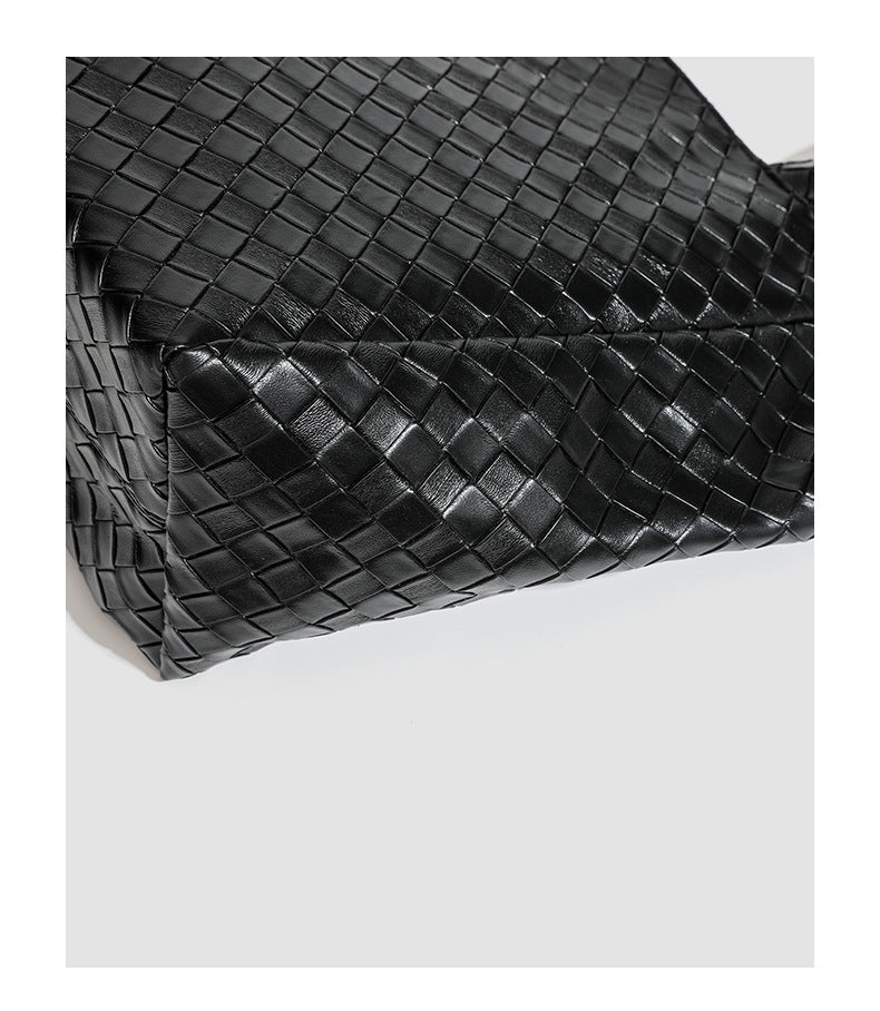 Large structured black woven diamond-pattern tote bag with braided double shoulder straps and glossy leather-look finish