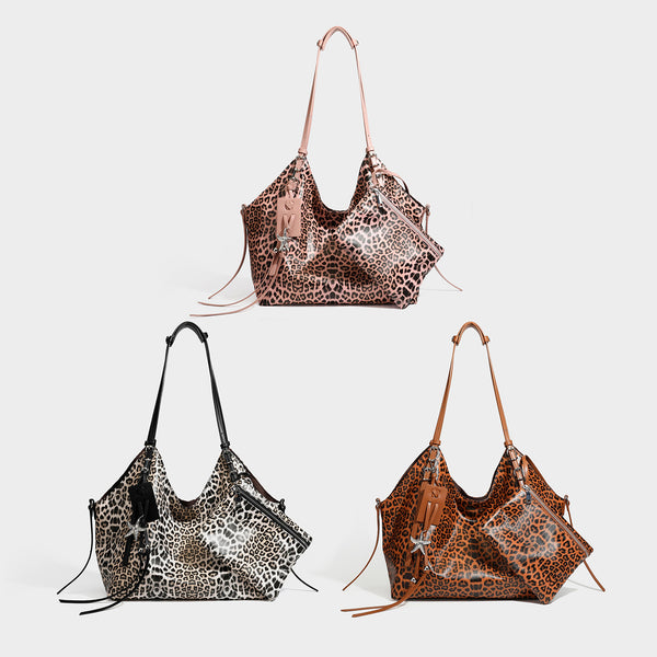 Large leopard print shoulder tote bag with glossy finish, long double straps, front zip pocket, silver-tone hardware, and
