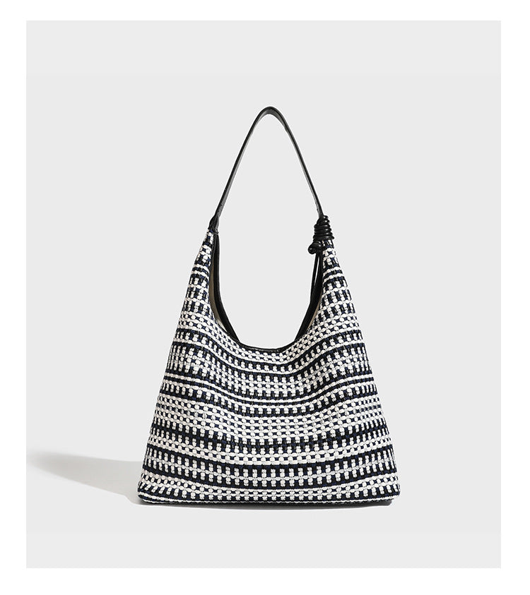 Slouchy woven stripe hobo shoulder bag with black-and-white pattern and leather-look strap, detail view 10
