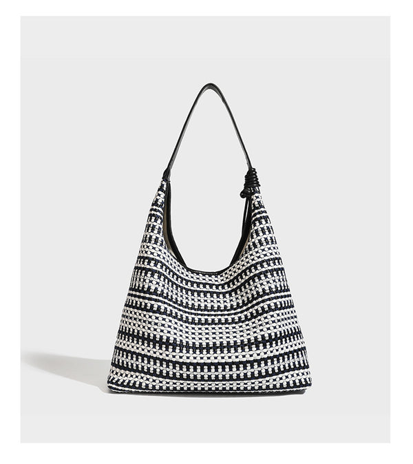 Slouchy woven stripe hobo shoulder bag with black-and-white pattern and leather-look strap, detail view 10