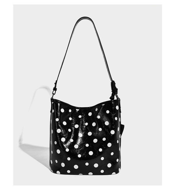 Glossy crinkled polka-dot bucket hobo bag with adjustable crossbody strap and side pouch, detail view 12