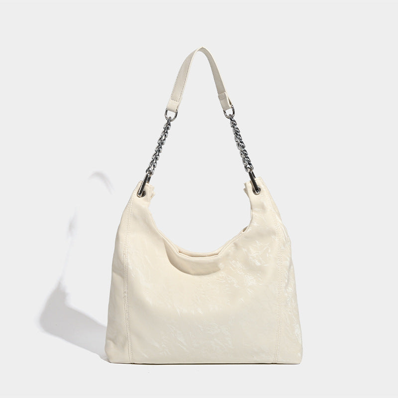 Large embossed leather-look shoulder tote bag with silver-tone chain strap, detail view 7