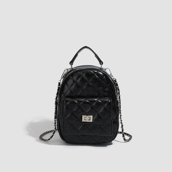 Quilted leather-look backpack purse with chain strap and turn-lock front pocket, detail view 10