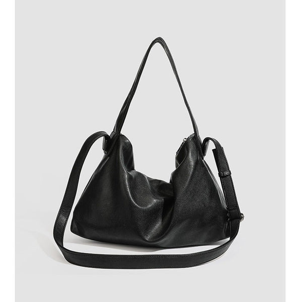 Slouchy leather-look hobo shoulder bag with top zipper and silver-tone hardware, detail view 4