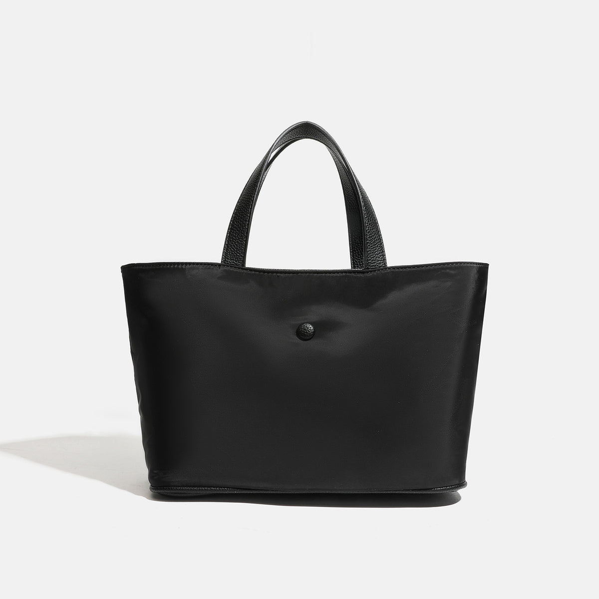 Structured lightweight nylon tote bag with textured double top handles and snap-button front detail, detail view 8
