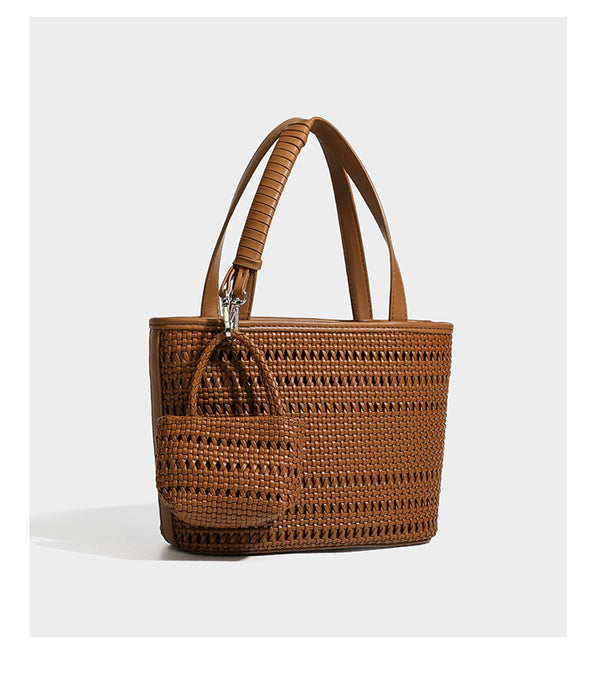 Structured open-weave tote bag with smooth leather-look trim, double top handles, detachable crossbody strap, and mini zip