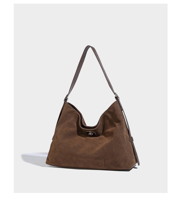 Slouchy hobo shoulder bag with turn-lock flap closure and adjustable strap, detail view 12
