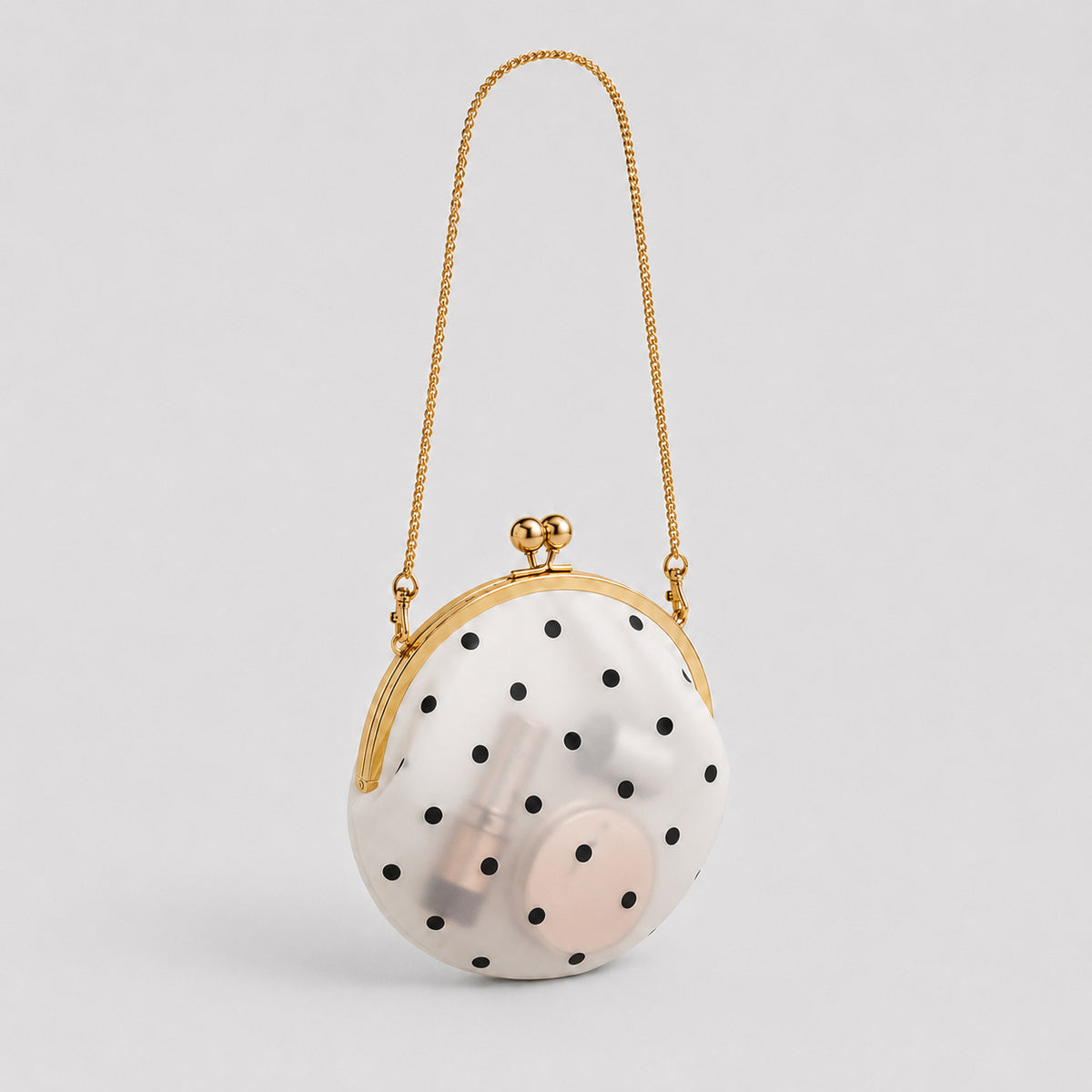 Mini round polka-dot shoulder bag with gold-tone kiss-lock frame and chain strap, detail view 2