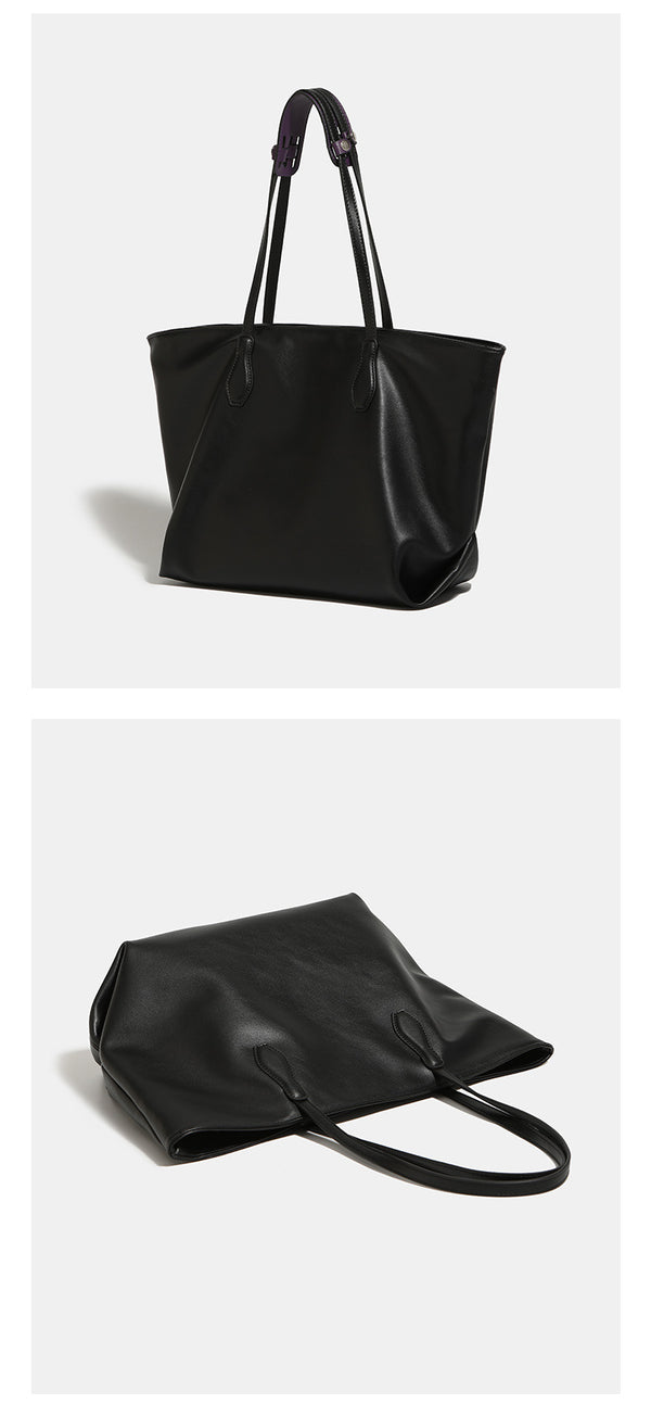 Large black leather-look trapezoid tote bag with double shoulder straps and purple accent hardware, detail view 7