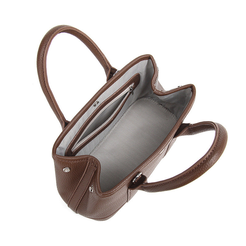 Structured pebbled leather-look top-handle tote bag with elephant charm and detachable shoulder strap, detail view 4