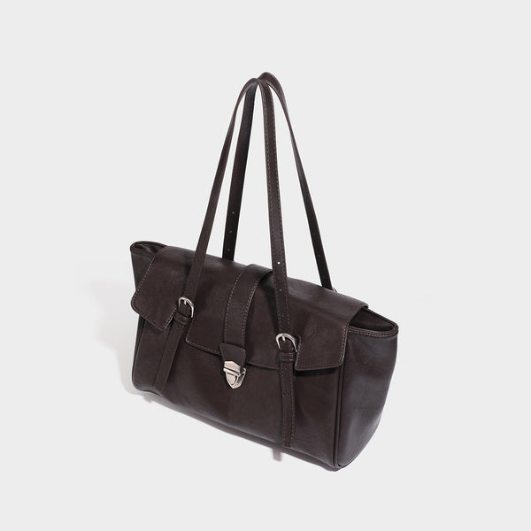 Large structured vintage-style tote bag with flap-front turn-lock closure, twin buckle straps, and double shoulder handles