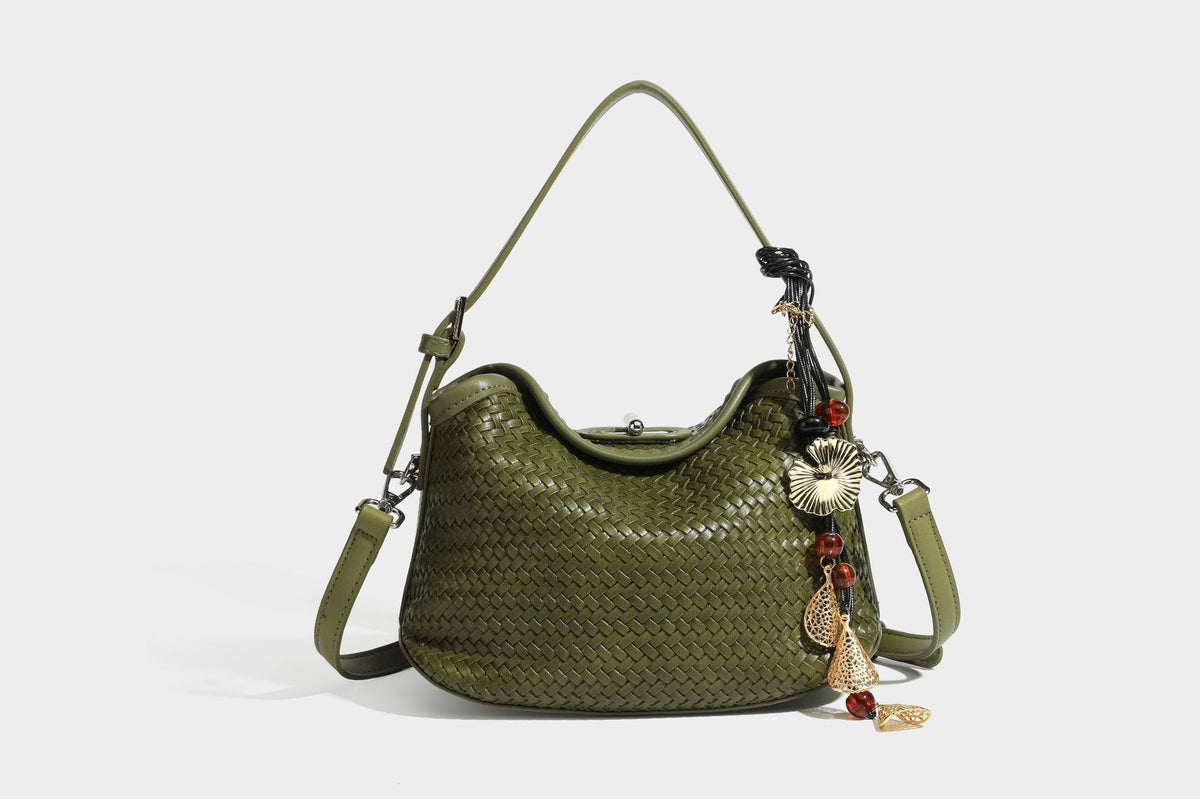 Small woven-look leather-look flap shoulder hobo bag in burgundy with silver-tone hardware and decorative tassel charm