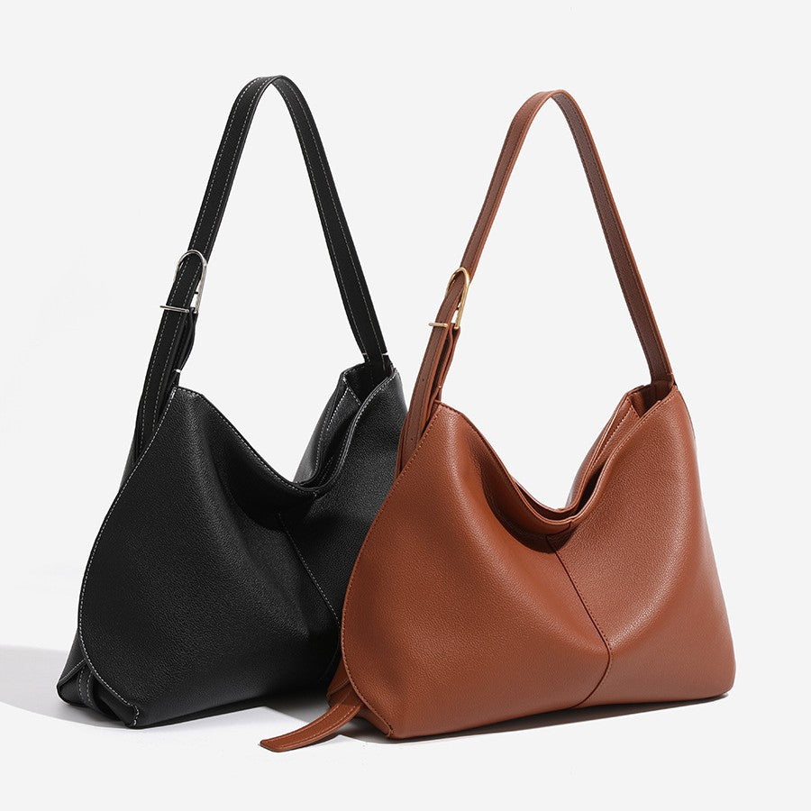 Large crescent hobo tote bag with pebbled leather-look finish, V-shaped open top, and adjustable shoulder strap, front view