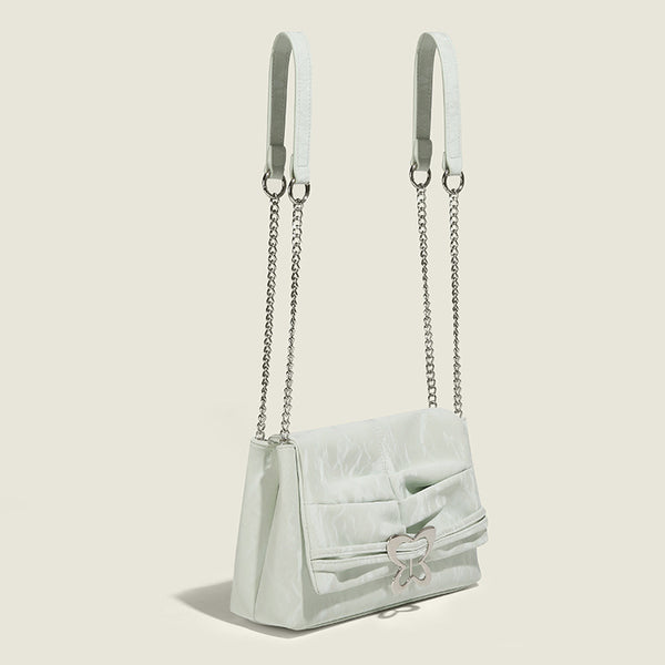 Structured rectangular chain shoulder bag with silver butterfly clasp and glossy crinkled finish, detail view 3