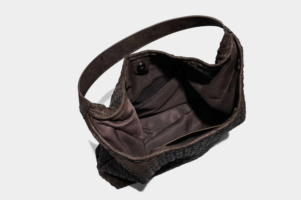 Slouchy woven hobo shoulder bag with knotted strap and matte leather-look textured finish, detail view 29