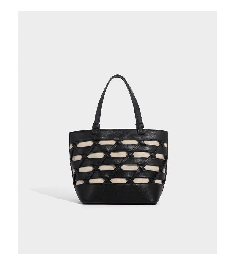 Structured woven lattice tote bag with cream lining, dual top handles, detachable crossbody strap, and silver-tone hardware