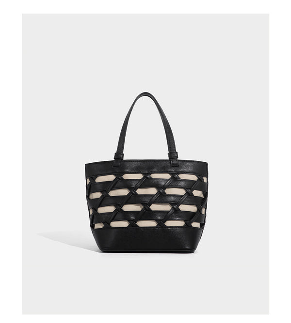 Structured woven lattice tote bag with cream lining, dual top handles, detachable crossbody strap, and silver-tone hardware