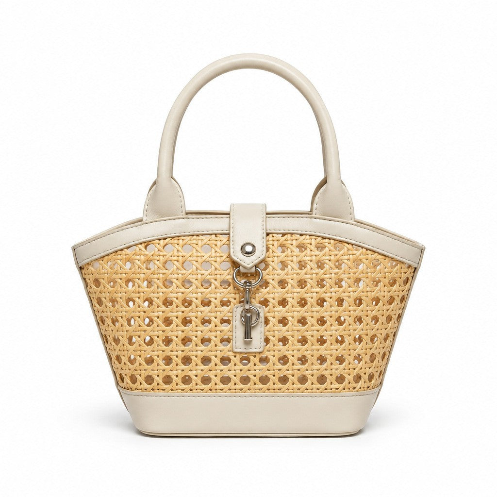 Structured mini tote bag with open-weave rattan body, leather-look arched handles and trim, front tab turn-lock closure, and
