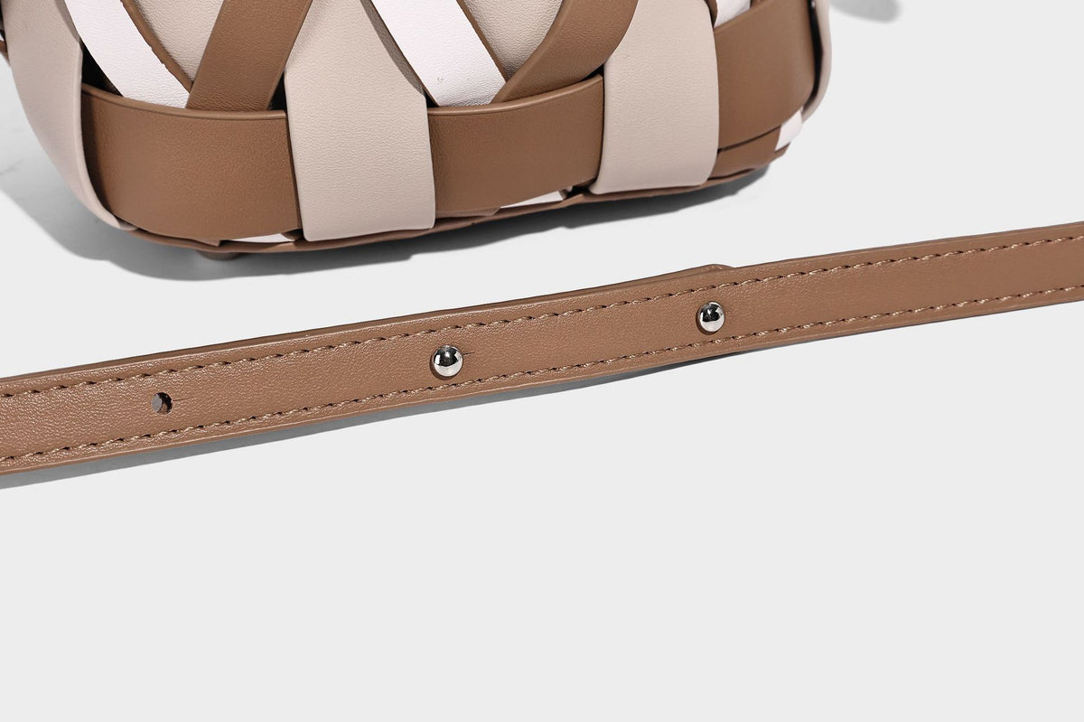 Small woven lattice bucket bag in tan and cream leather-look strips with drawstring top and detachable crossbody strap