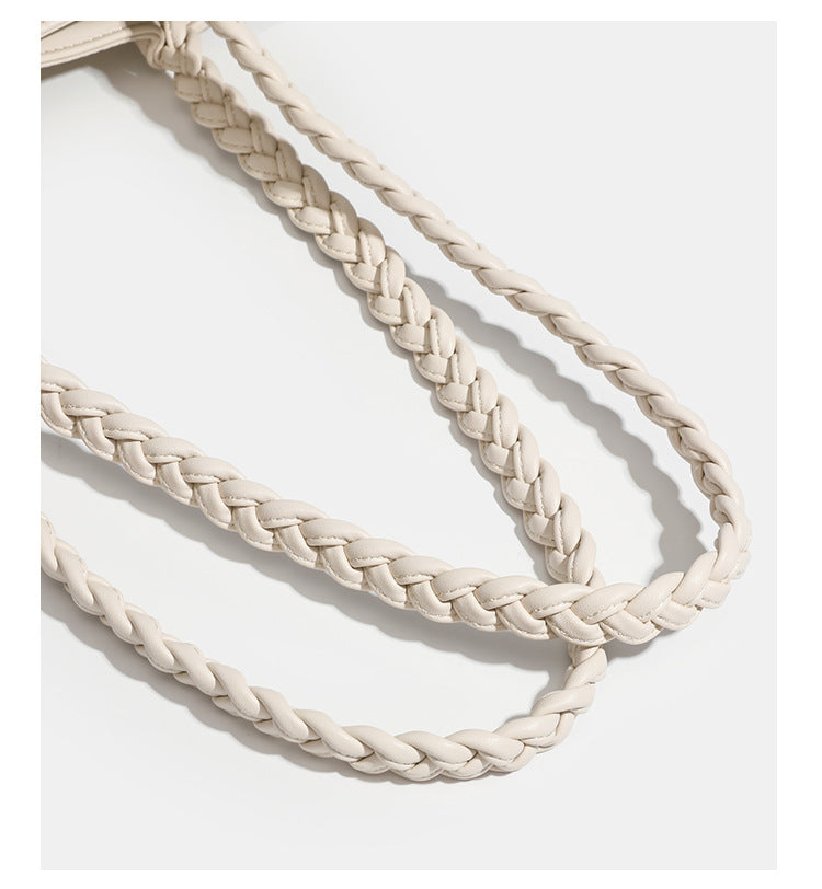 Structured geometric-embossed tote bag with braided shoulder straps and gold-tone hardware in ivory, detail view 16
