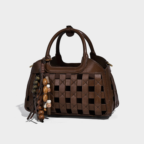 Small structured woven lattice top-handle satchel bag with bead-and-tassel charm and gold-tone hardware, front view