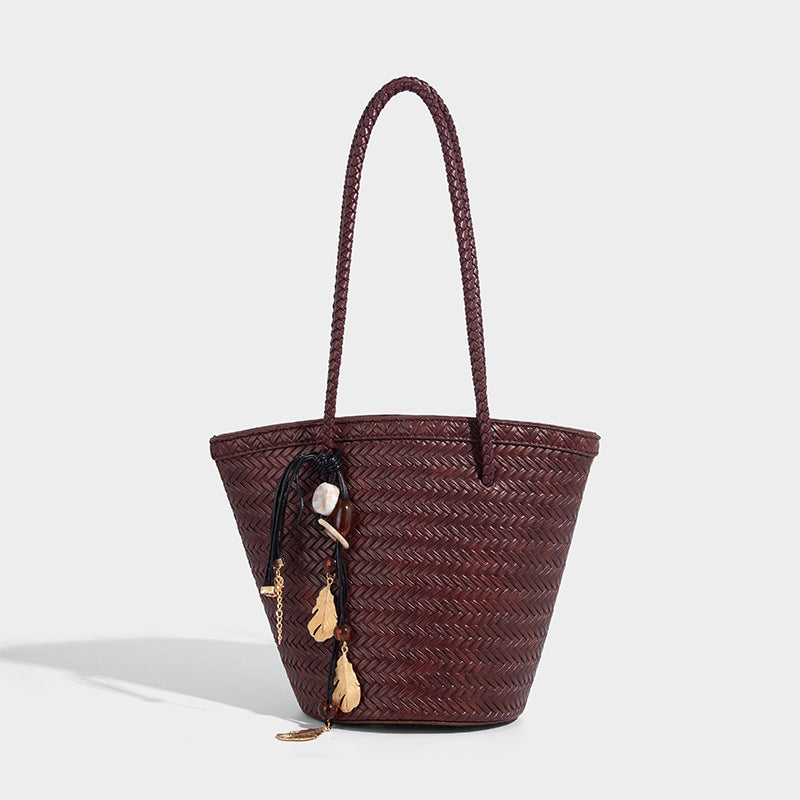 Chevron-woven bucket tote bag with braided shoulder straps and matching drawstring pouch, detail view 7